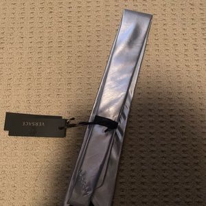 This is a silver high quality Versace tie.